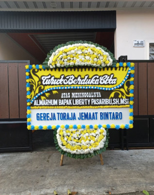 Papan Bunga Duka di Koragi